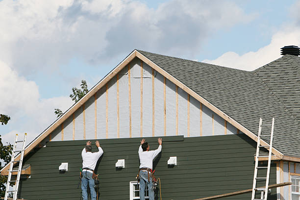 Professional Siding technician working in Four Oaks, NC
